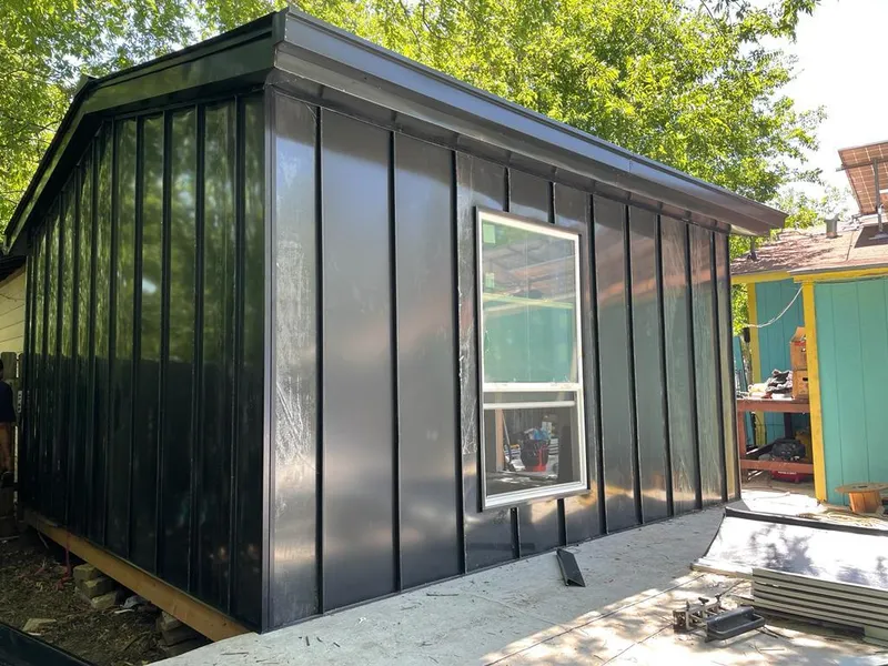 Black standing seam metal wall panels for Roof Inspection in White Rock