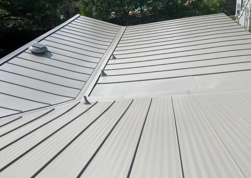 Solar attic fan installed on a metal roof for Roof Ventilation in White Rock